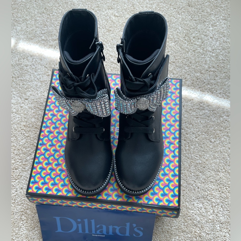 Leather Kurt Geiger boots with zip closure and embellished accent bow.